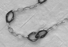 Hinged clasp is shown closed, open it can slip onto any part of the necklace!