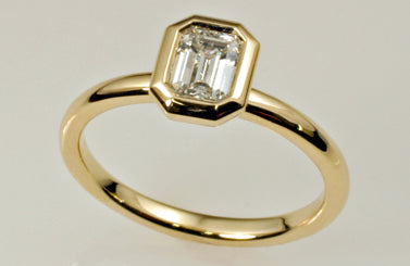 1. Emerald Cut Diamond Solitaire Engagement Ring