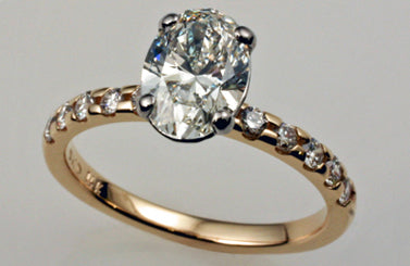 1. Oval Diamond Solitaire Plus Engagement Ring